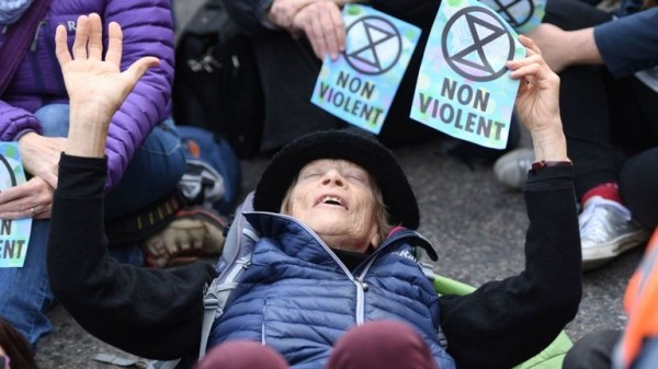 Extinction Rebellion protester climbs on plane at London City Airport
Extinction Rebellion protester climbs on plane at London City Airport